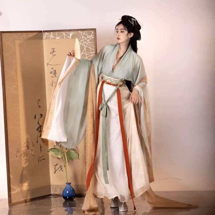 The Revival of Green-Pink Cheongsam:A Closer Look at Traditional Elegance The Revival of Green-Pink Cheongsam:A Closer Look at Traditional Elegance