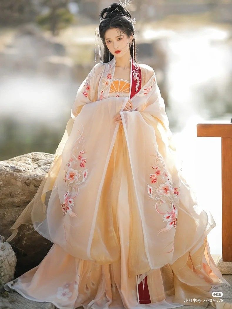Wine Red Salutation Gown Qipao for the Bride:A Closer Look at Her Elegant Attire Wine Red Salutation Gown Qipao for the Bride:A Closer Look at Her Elegant Attire